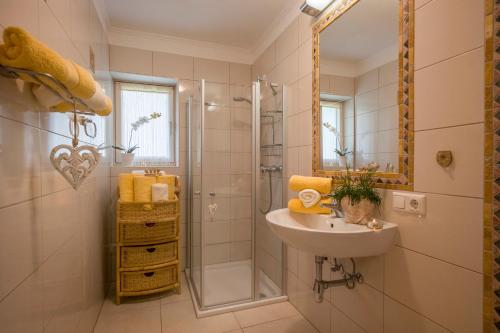 a bathroom with a sink and a shower at Apart Blassnig in Maurach