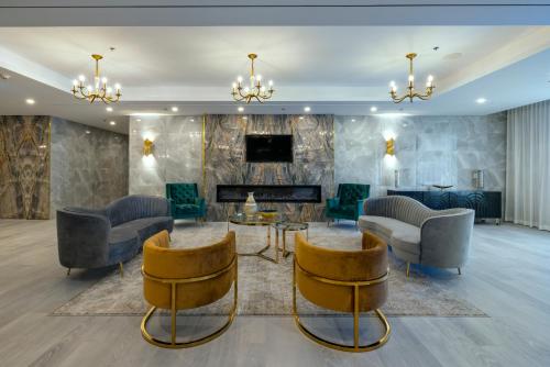 a living room with chairs and a fireplace at Halifax Tower Hotel & Conference Centre, an Ascend Collection Hotel in Halifax