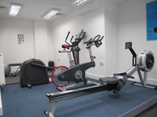 a gym with a treadmill and a exercise bike at BLOOMSBURY APARTMENTS in London