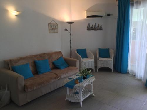a living room with a couch and two chairs at Apt14 Porto Antigo 1 with Pool and Beach views in Santa Maria