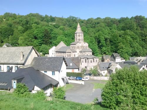 an image of a village with a church at Basilic, 4 pers. Villa Saint Antoine, Orcival, Sancy Auvergne in Orcival