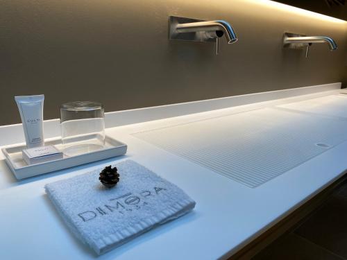 a bathroom counter with a sink with a candle on it at DIMORA1934 Relax&Comfort in Tirano