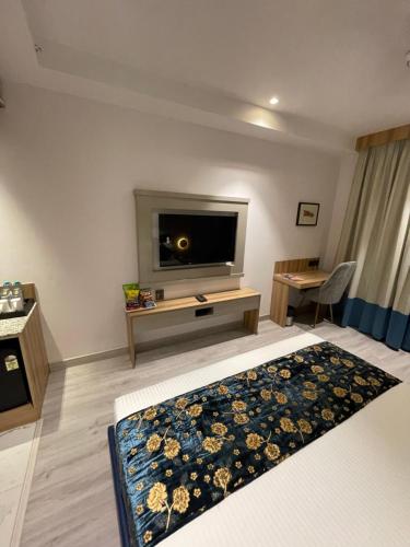 En eller flere senger på et rom på Hotel Malbork Inn @ Janakpuri