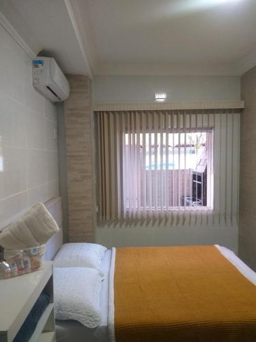 Katil atau katil-katil dalam bilik di Casa 2 Encanto dos Mares
