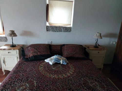 Letto o letti in una camera di Stazzo vista mare