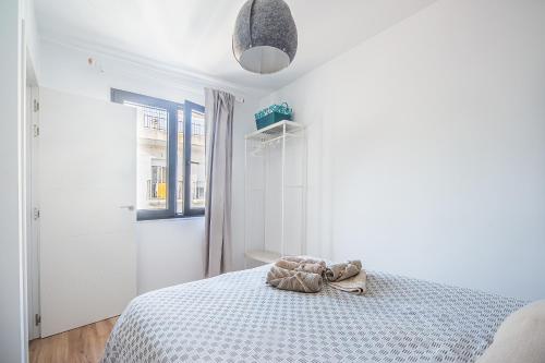 Postel nebo postele na pokoji v ubytování CARTAGENAFLATS, Apartamentos Anfiteatro Romano 5A