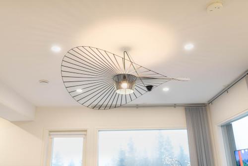 a fan hanging from the ceiling of a room at Villa Aurora in Rovaniemi