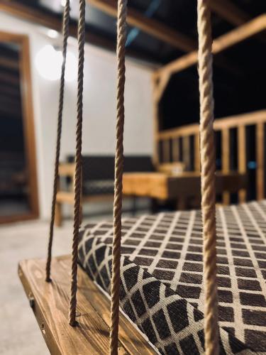 a rope swing with a black and white rug at Mount House Mavrovo in Mavrovo