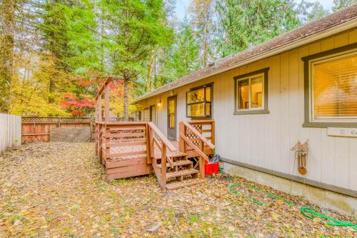 a home with a porch and a house at The Fox Den in Rhododendron