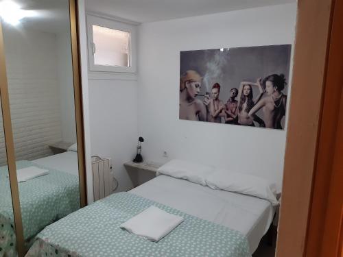 A bed or beds in a room at Moderno y centrico apartamento en Vigo