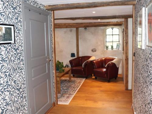 a hallway with a room with chairs and a table at 4 person holiday home in SIMLÅNGSDALEN-By Traum in Simlångsdalen