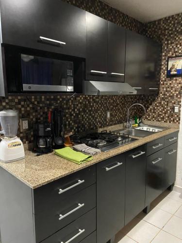 Una cocina o zona de cocina en Condominios Brisas