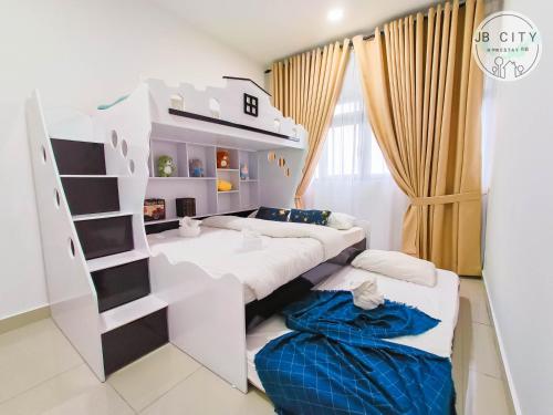a room with two beds and a bunk bed at Pangsapuri Meridian by RR JBcity in Nusajaya