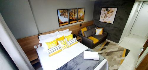 En eller flere senge i et værelse på Flat Sunshine - Granja Brasil Resort - Itaipava