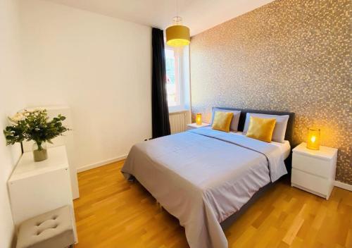 a bedroom with a large bed and two night stands at GIOIA@HOME in Locarno