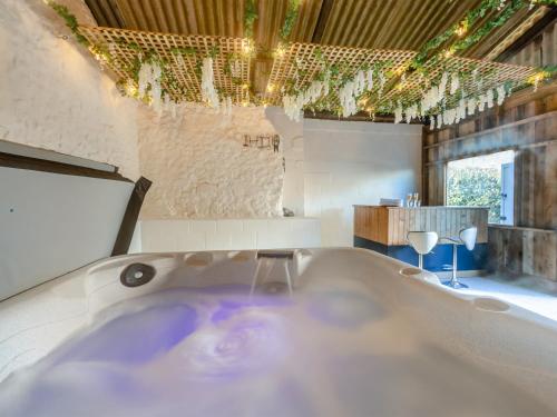 a bath tub in a room with at The Moat House in Cudworth