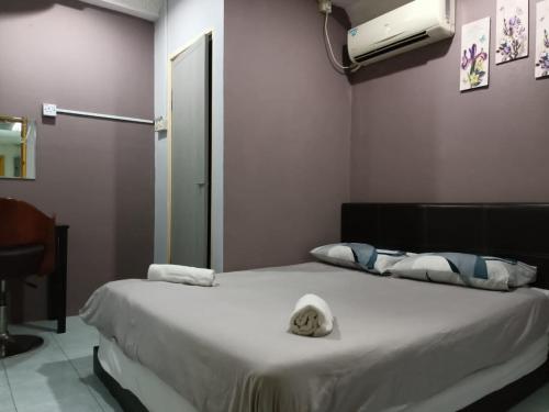 Postel nebo postele na pokoji v ubytování Hotel Tropicanna Pulai Point