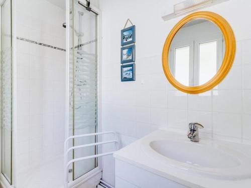 a white bathroom with a sink and a mirror at Appartement Esquièze-Sère, 3 pièces, 6 personnes - FR-1-402-26 in Esquièze - Sère