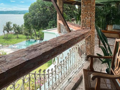 a balcony of a house with a view of the water at Nuuk Taal Lake in Laurel