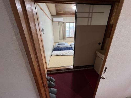 Ένα ή περισσότερα κρεβάτια σε δωμάτιο στο HOSTEL OE
