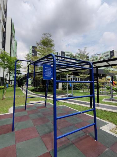 a blue bus stop with a sign on it at PoolView Waterpark 300Mbps Ipoh Homestay Manhattan Condo 4-7pax 3bedroom Station 18 pengkalan in Ipoh