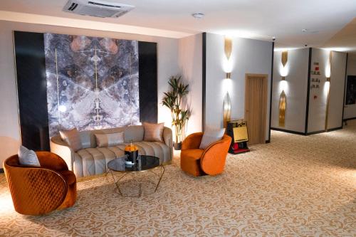 Posezení v ubytování Al Yarmouk International Hotel
