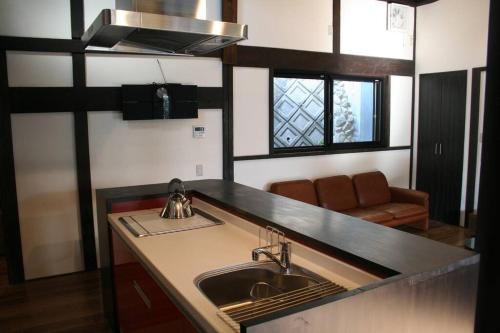 a kitchen with a sink and a counter top at Traditional/modern Kyoto Paradise in quiet area! in Iwakura