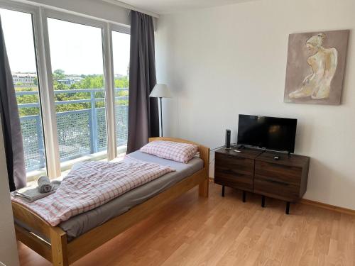 Llit o llits en una habitació de LEA Apartments Zoo Panoramablick mit Terasse