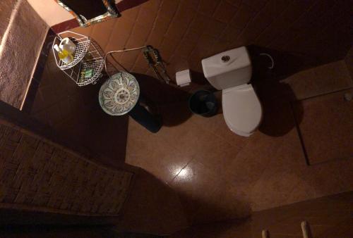 an overhead view of a bathroom with a toilet and a sink at La Fibule D'or in Aït Benhaddou