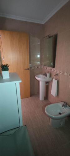 a bathroom with a sink and a toilet at Villa Terreros in San Juan de los Terreros