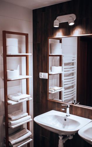 a bathroom with a sink and a mirror at LB Domek w centrum Willowa 3 in Szczyrk