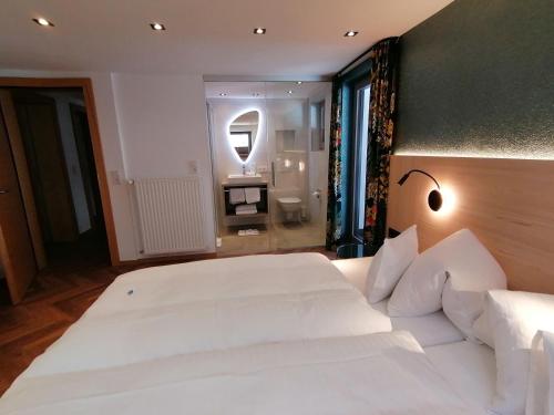 Letto o letti in una camera di Haus Marion Haueis
