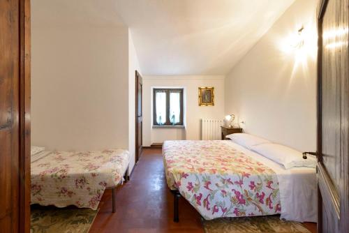 Ένα ή περισσότερα κρεβάτια σε δωμάτιο στο Agriturismo Casanova
