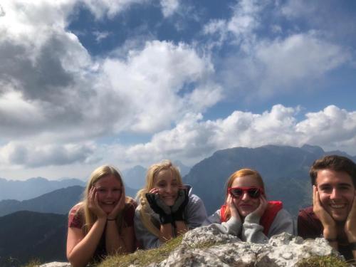 a group of people laying on top of a mountain at nawu apartments & Restaurant in Hermagor