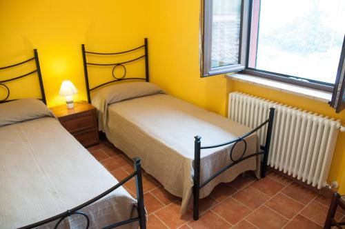Cama o camas de una habitación en Cascina La Romana