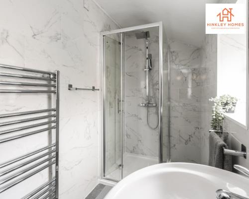 a shower with a glass door in a bathroom at Stylish Home 8 Guests - Liverpool - Free Wifi & Parking By Hinkley Homes Short Lets & Serviced Accommodation in Liverpool