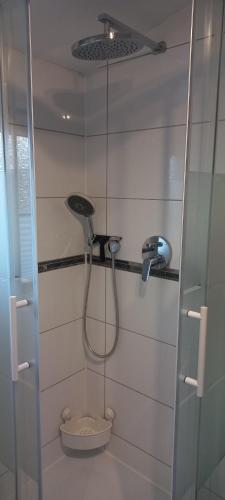 a bathroom with a shower and a toilet in it at Messe Luxury room in Hannover