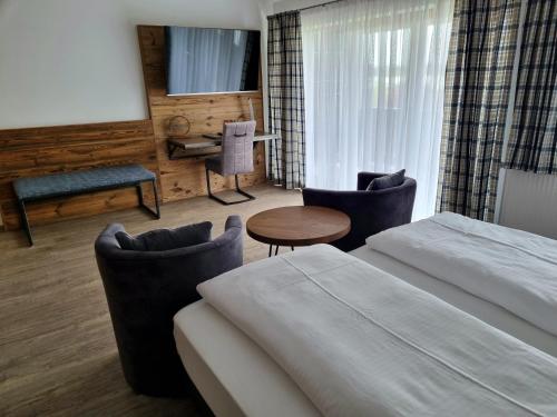 Postel nebo postele na pokoji v ubytování Hotel Beinbauer