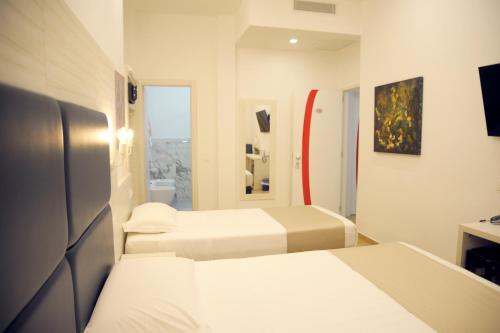 Postel nebo postele na pokoji v ubytování Hotel Fioralba