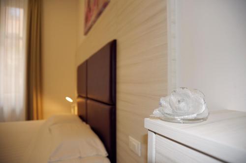 Postel nebo postele na pokoji v ubytování Hotel Fioralba