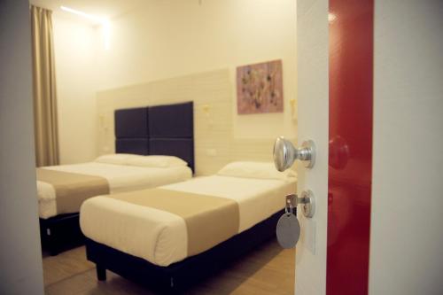 Postel nebo postele na pokoji v ubytování Hotel Fioralba