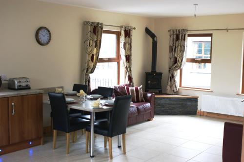a living room with a table and a couch at Glendun Self Catering in Cushendall