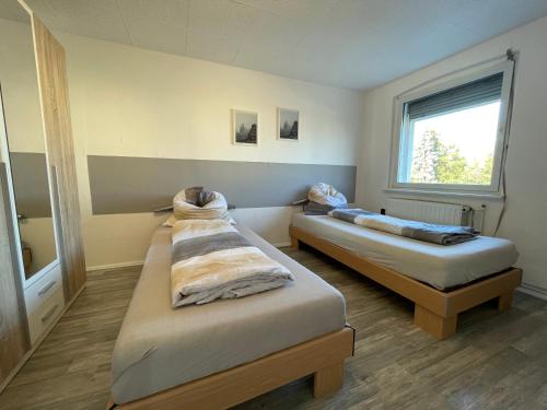 Postel nebo postele na pokoji v ubytování Monteurunterkunft Haus 19