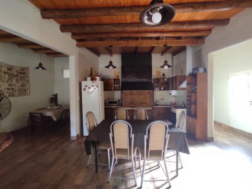 a kitchen and dining room with a table and chairs at Casona Alma en Calma San Rafael in San Rafael