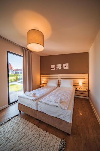 Llit o llits en una habitació de TERMAL KRE-SPA