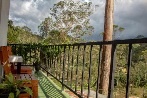 a balcony with a view of a tree at Water Side Residence in Adams Peak