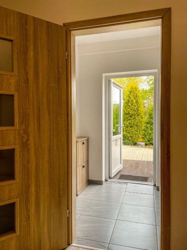 an open door to a room with a tile floor at Agroturystyka"u Piwowara" in Kłodzko