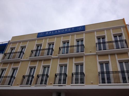 a building with a sign on the side of it at Hotel Boutique Balandret in Valencia