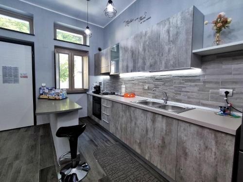 a large kitchen with a sink and a counter at The Junior House - Casa Vacanza in Lauria