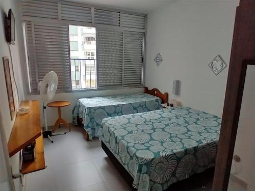 Ein Bett oder Betten in einem Zimmer der Unterkunft Apto 1 dorm. Guarujá - Pitangueiras - perto da praia